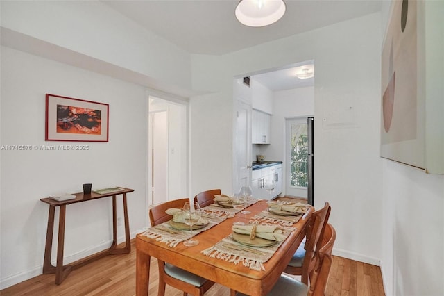 dining area with light hardwood / wood-style flooring