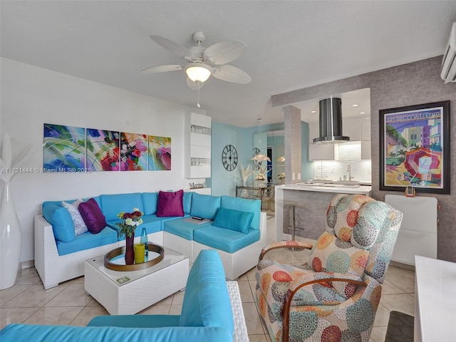 living room featuring light tile patterned floors and ceiling fan