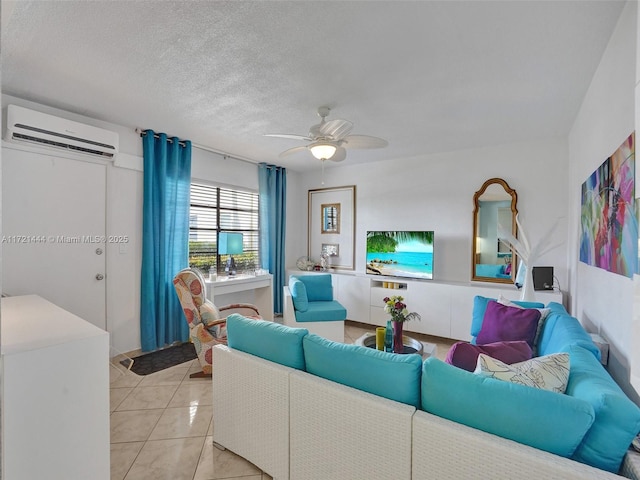 tiled living room with a wall mounted air conditioner, ceiling fan, and a textured ceiling