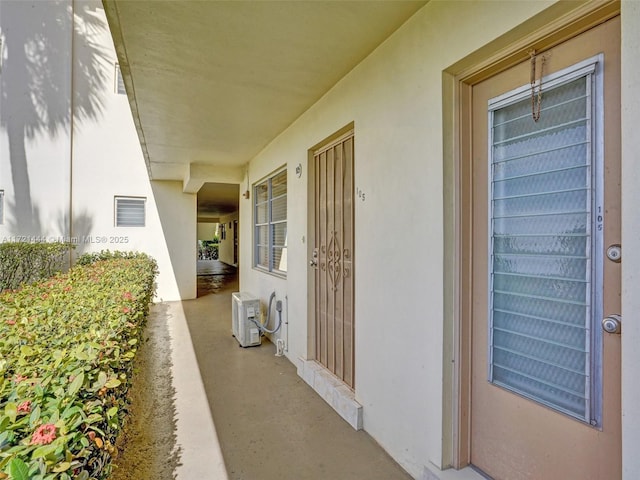 doorway to property with ac unit