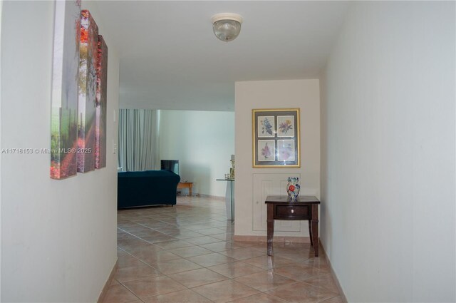 hallway with light tile patterned floors