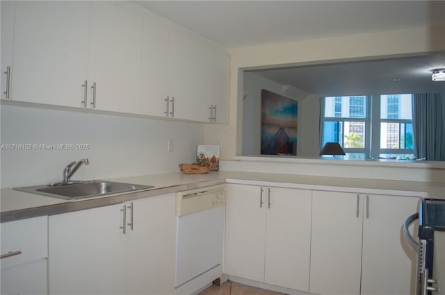 kitchen featuring white cabinets, dishwasher, and sink