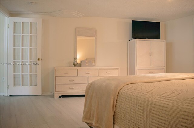 bedroom with light wood-type flooring