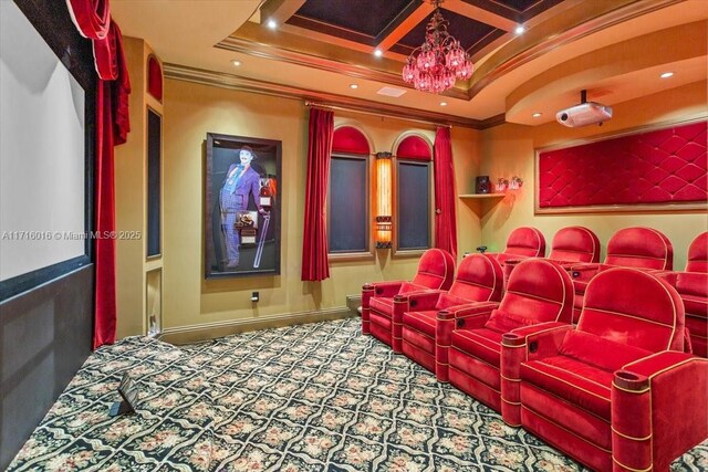 carpeted cinema room featuring an inviting chandelier, ornamental molding, coffered ceiling, and beamed ceiling