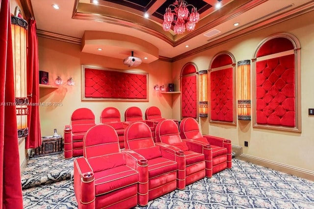 carpeted home theater room featuring beamed ceiling, ornamental molding, coffered ceiling, and a chandelier