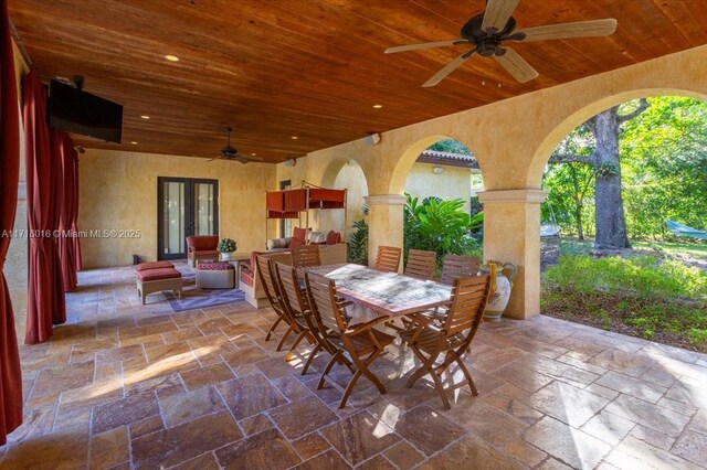 view of patio with ceiling fan and french doors