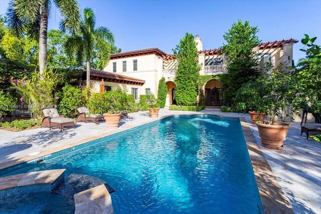 view of swimming pool featuring a patio area