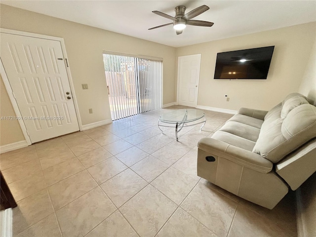 living room with ceiling fan and light tile patterned floors