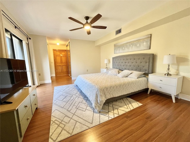 bedroom featuring hardwood / wood-style floors and ceiling fan