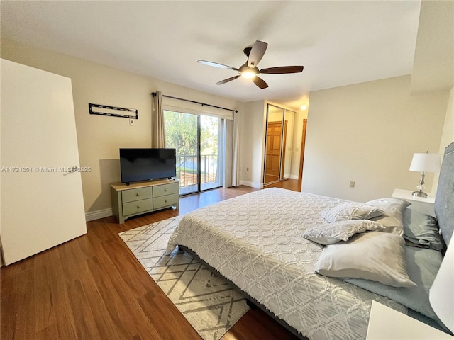 bedroom featuring access to exterior, ceiling fan, and wood-type flooring