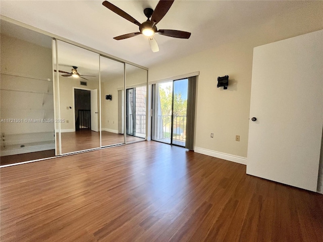 empty room with wood-type flooring and ceiling fan