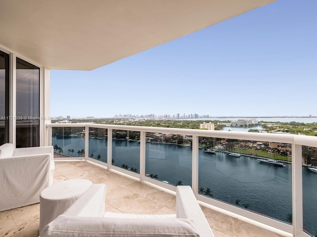 balcony featuring a water view