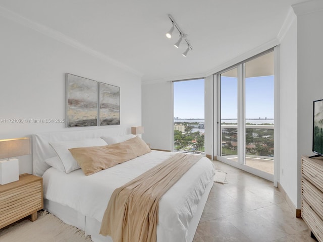 bedroom with access to outside, floor to ceiling windows, track lighting, and ornamental molding