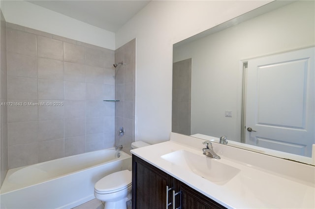 full bathroom with toilet, vanity, and tiled shower / bath combo