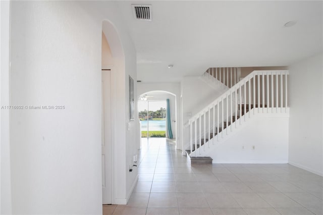 foyer entrance with light tile patterned floors