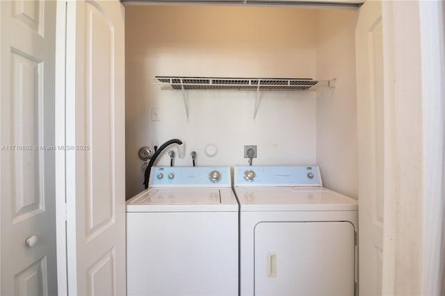 laundry area with laundry area and washer and clothes dryer