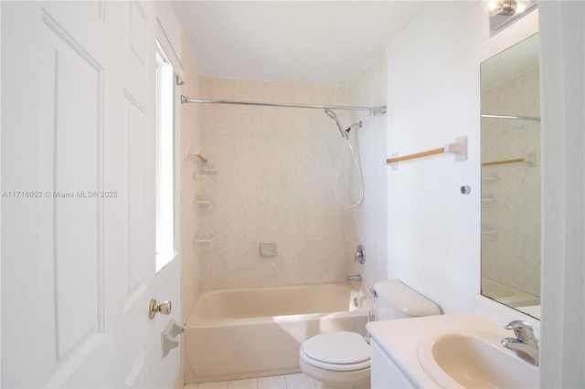 bathroom featuring tile patterned floors, bathing tub / shower combination, toilet, and vanity