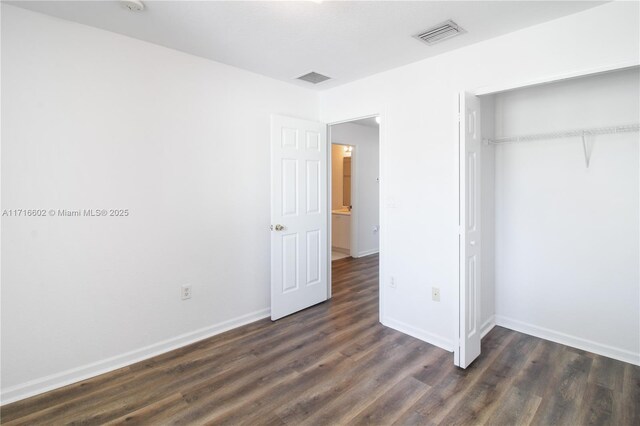 bedroom featuring dark hardwood / wood-style floors