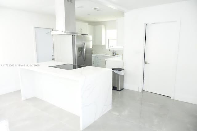 kitchen featuring stainless steel fridge with ice dispenser, island range hood, sink, and white cabinets