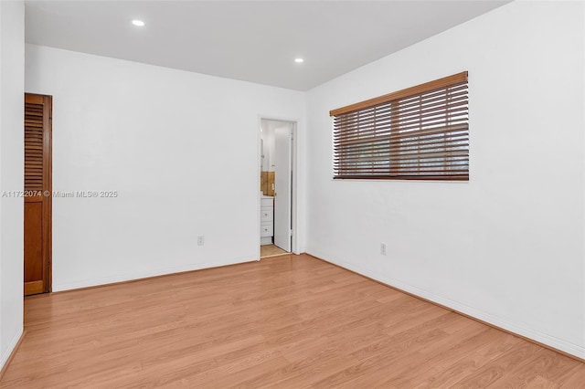 empty room with light wood-type flooring