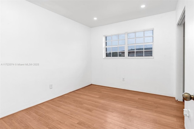 unfurnished room featuring light hardwood / wood-style floors