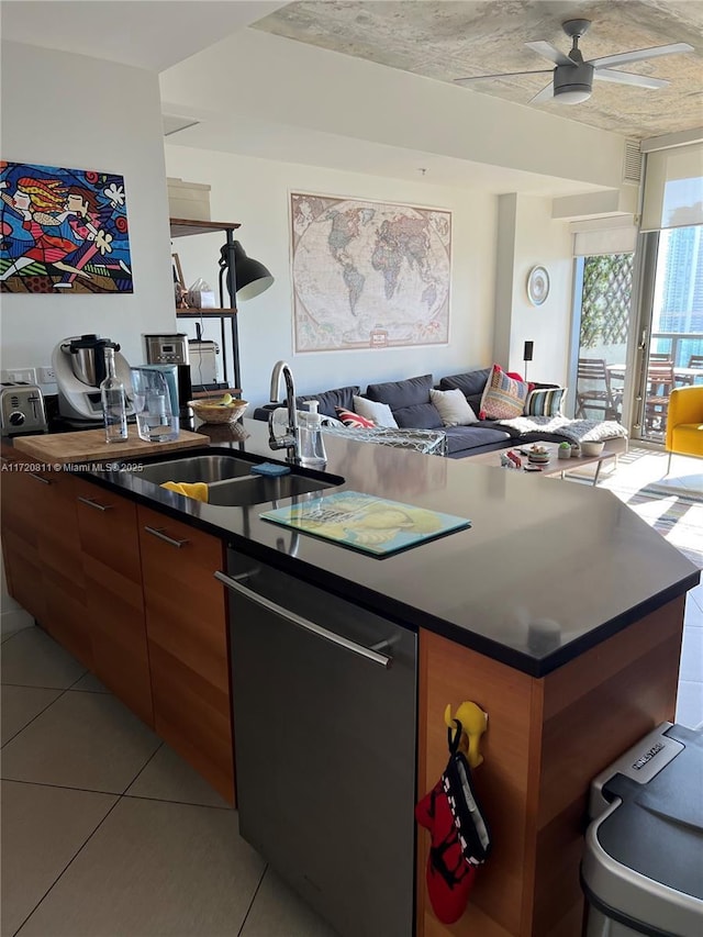 kitchen with stainless steel dishwasher, ceiling fan, light tile patterned floors, and sink