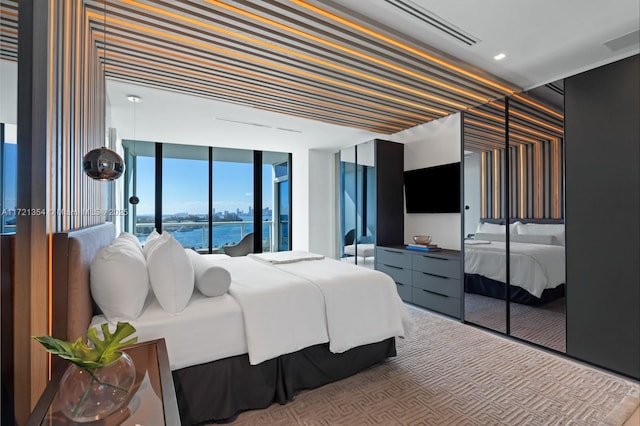 carpeted bedroom with wallpapered walls