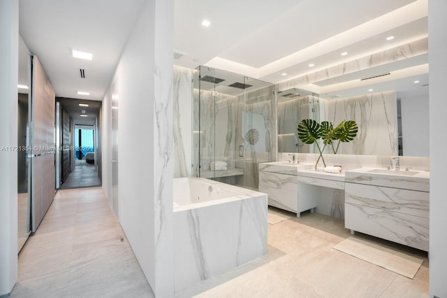 full bath with a garden tub, tile patterned floors, vanity, a marble finish shower, and recessed lighting