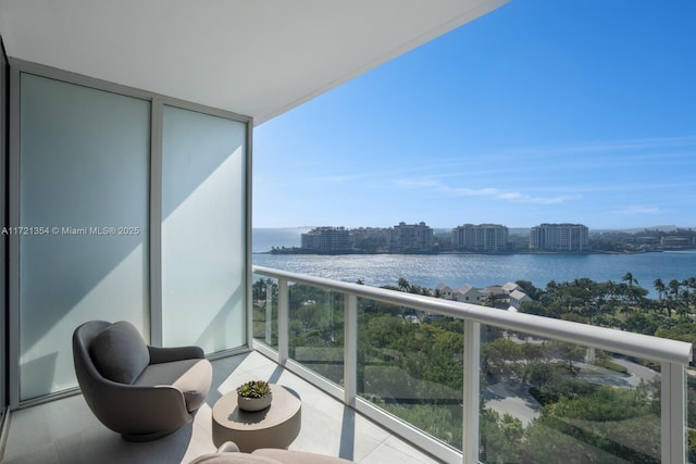 balcony with a view of city and a water view