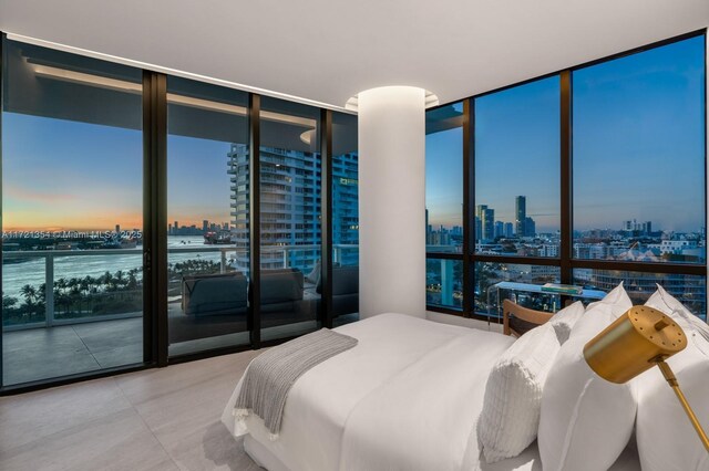 bedroom featuring a wall of windows and multiple windows