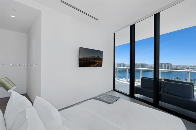 100 S Pointe Dr Unit 1201/1202, Miami Beach, FL 33139 - bedroom featuring expansive windows and multiple windows