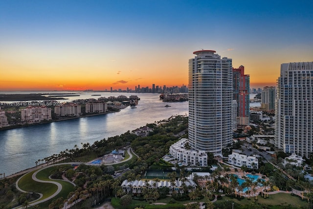 aerial view at dusk with a water view