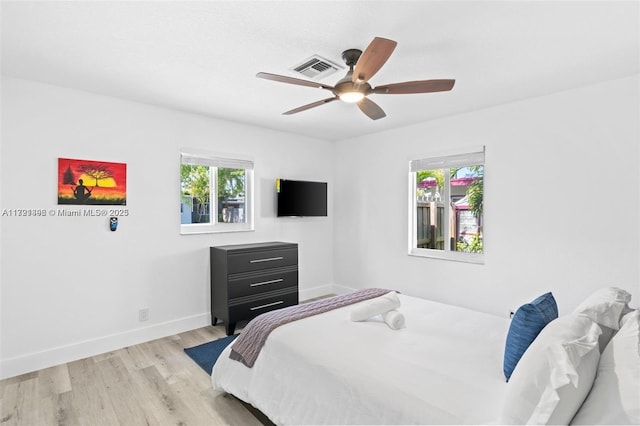 bedroom featuring ceiling fan and light wood-type flooring