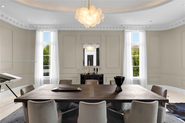 dining space with a chandelier and ornamental molding