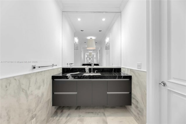 bathroom with vanity and crown molding