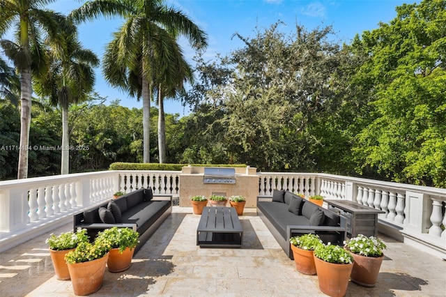 view of patio with a grill, area for grilling, and an outdoor hangout area