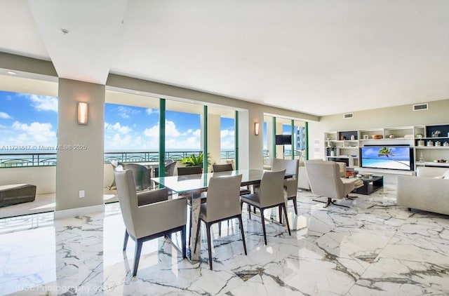 dining area featuring a water view