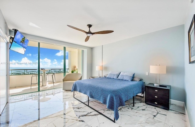 bedroom featuring ceiling fan, expansive windows, and access to exterior