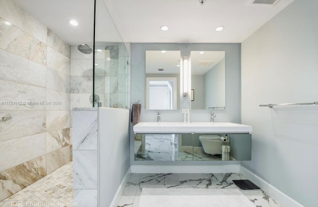 bathroom featuring vanity and a shower