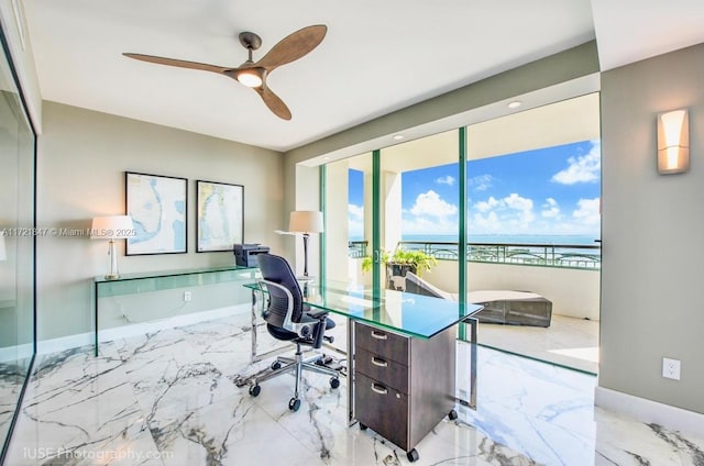 home office featuring ceiling fan and a water view