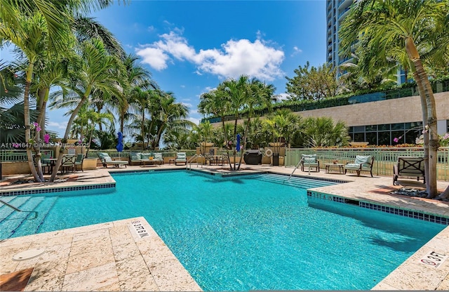 view of swimming pool featuring a patio area