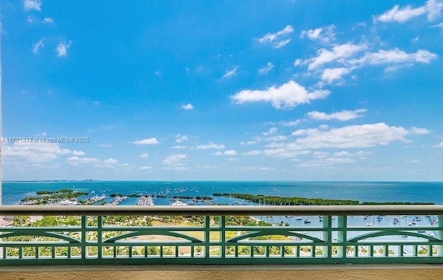 balcony featuring a water view