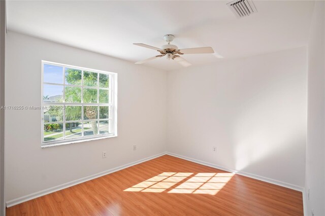 unfurnished bedroom with hardwood / wood-style floors, a closet, and ceiling fan