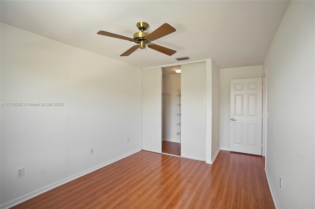 spare room featuring ceiling fan and light hardwood / wood-style floors