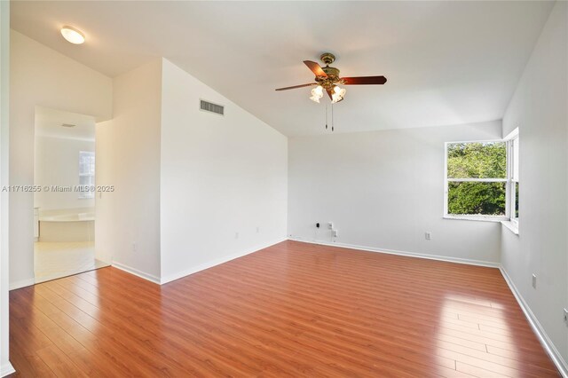 unfurnished room featuring ceiling fan and light wood-type flooring