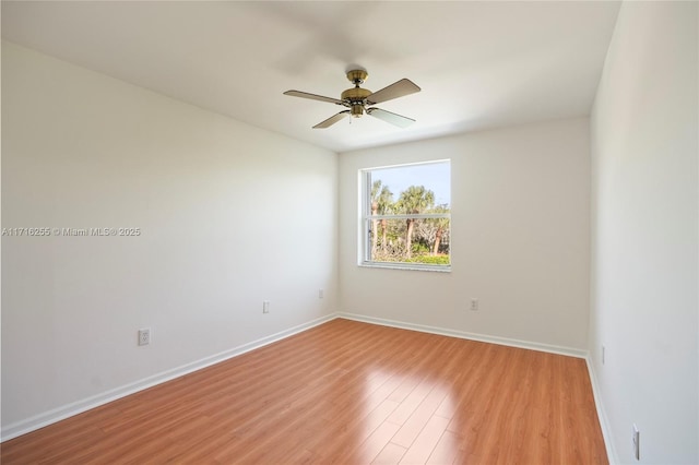 empty room featuring ceiling fan and light hardwood / wood-style floors