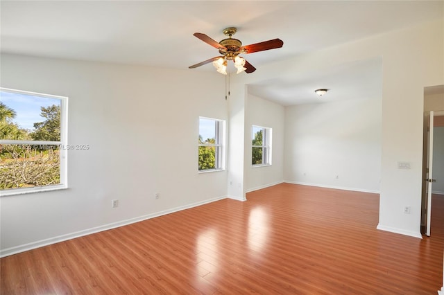 unfurnished room with ceiling fan and light hardwood / wood-style floors