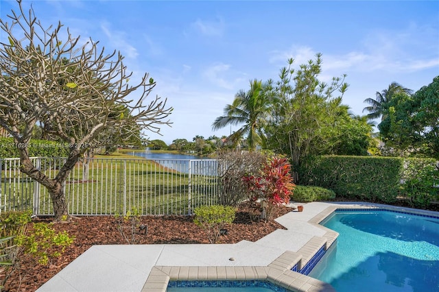 view of pool with a water view