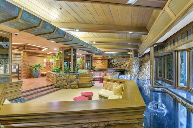 dining room with beam ceiling and wood ceiling