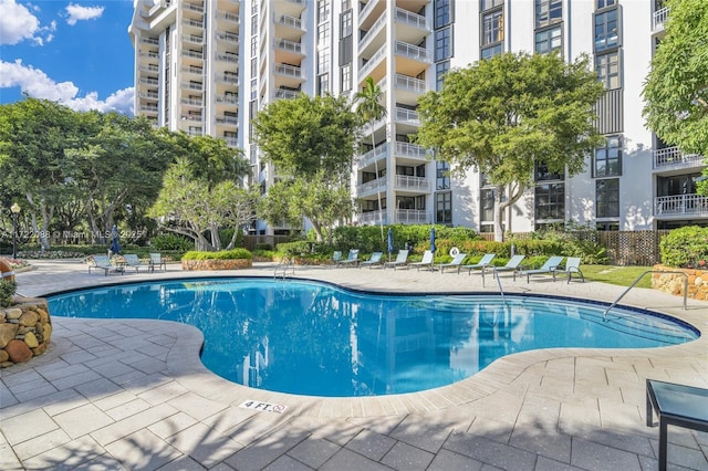 view of pool featuring a patio